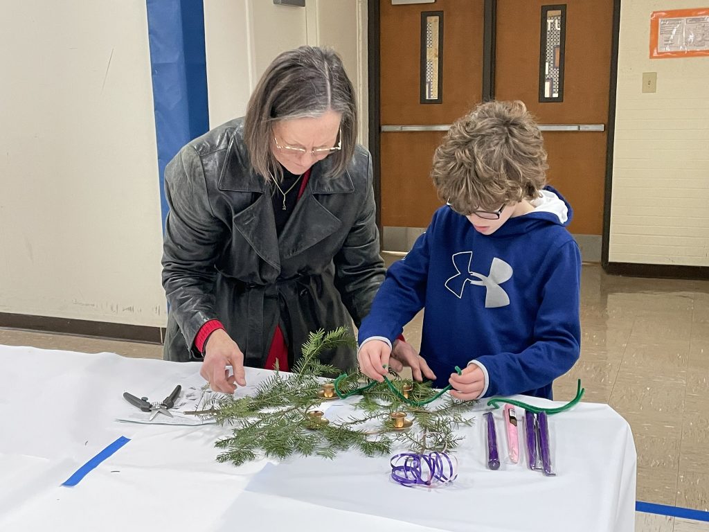 family making a wreath together